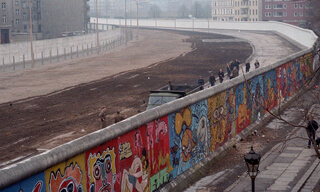 Berlin Wall was taken in 1986 by Thierry Noir at Bethaniendamm in Berlin-Kreuzberg