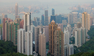 Hong Kong's high land prices and geographic limitations justify the construction of skyscrapers