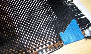 Fabric made of woven carbon filaments